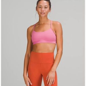 Lululemon Flow Y Bra in lavender. Tag is ripped off. Size 6. Worn a few times.